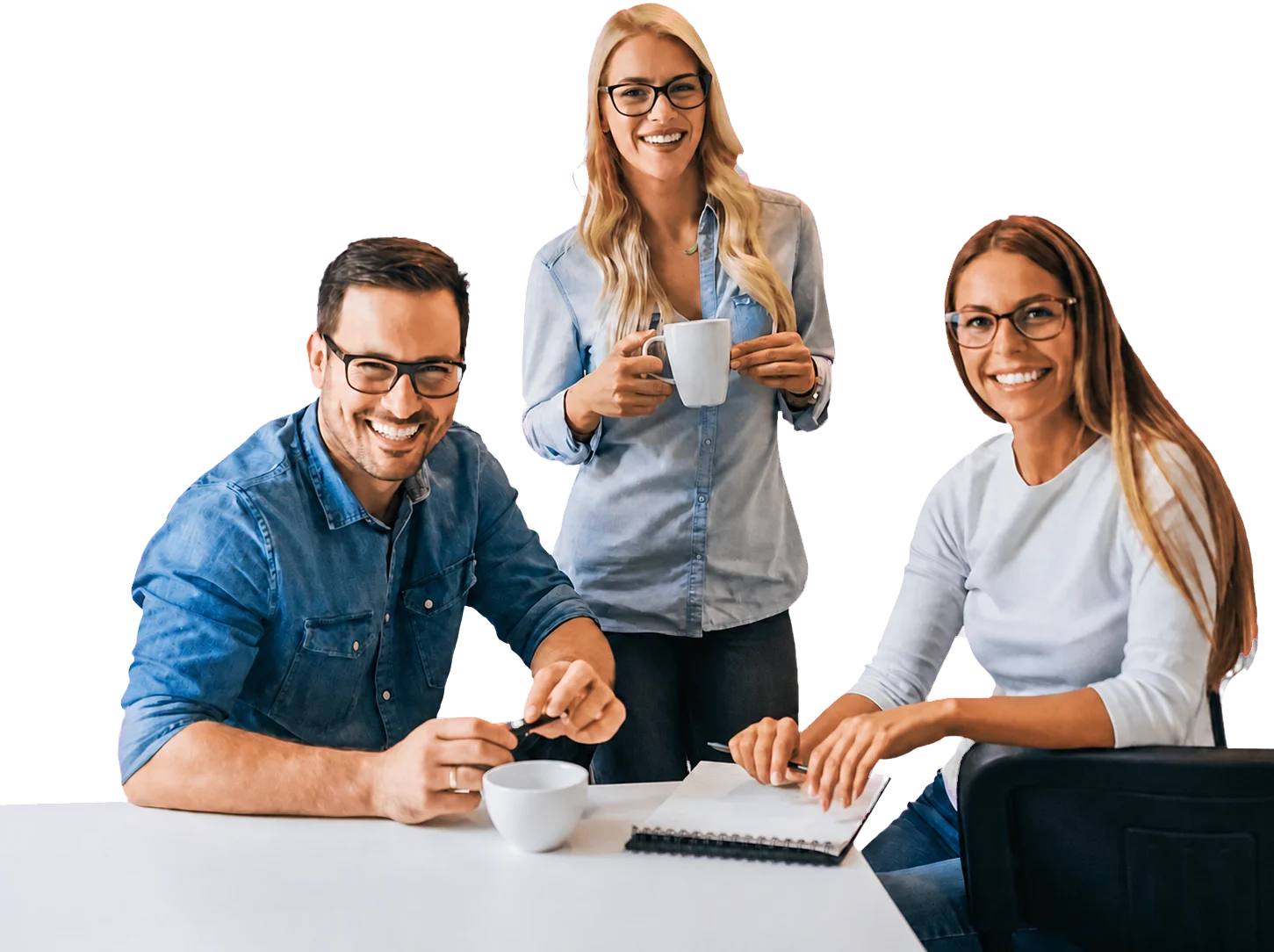 Three software professionals collaborating around a shared workspace